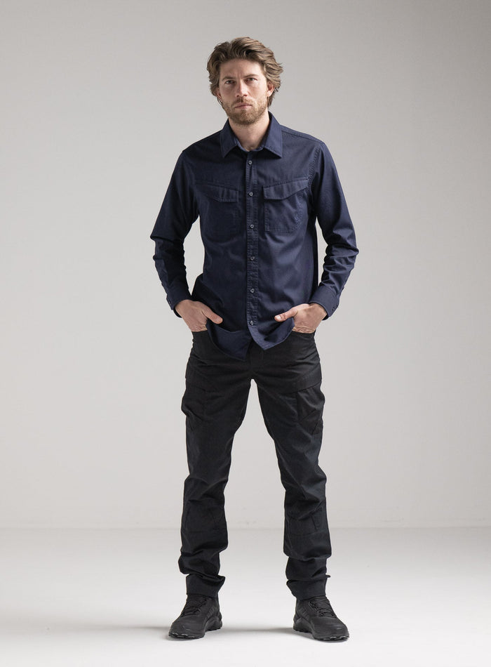Rudie Is 6ft 2" And Wears Size: M | Hem Studio Image Of Model Wearing Covert Shirt In Dark Sapphire (SS Model)