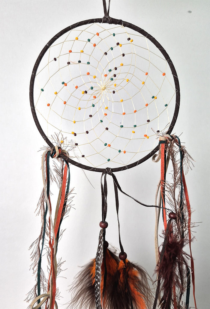 6" dark brown Fall Dream Catcher embellished with orange, green and black beads, leathers and feathers. Handmade in Canada.