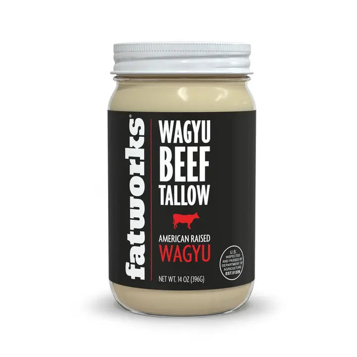 A jar of FATWORKS - AMERICAN WAGYU TALLOW by FATWORKS, with a white lid and black label noting “Wagyu Beef Tallow, American Raised Wagyu,” 14 oz (396g), is ideal for grilling due to its rich monounsaturated fat content.