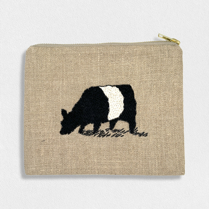 The FEARRINGTON LIFESTYLE COLLECTION - SIGNATURE BELTIE LINEN POUCH by CITRUS FASHIONS is a small beige pouch with a gold zipper, hand-stitched with a black and white grazing cow—ideal for carrying cosmetics.