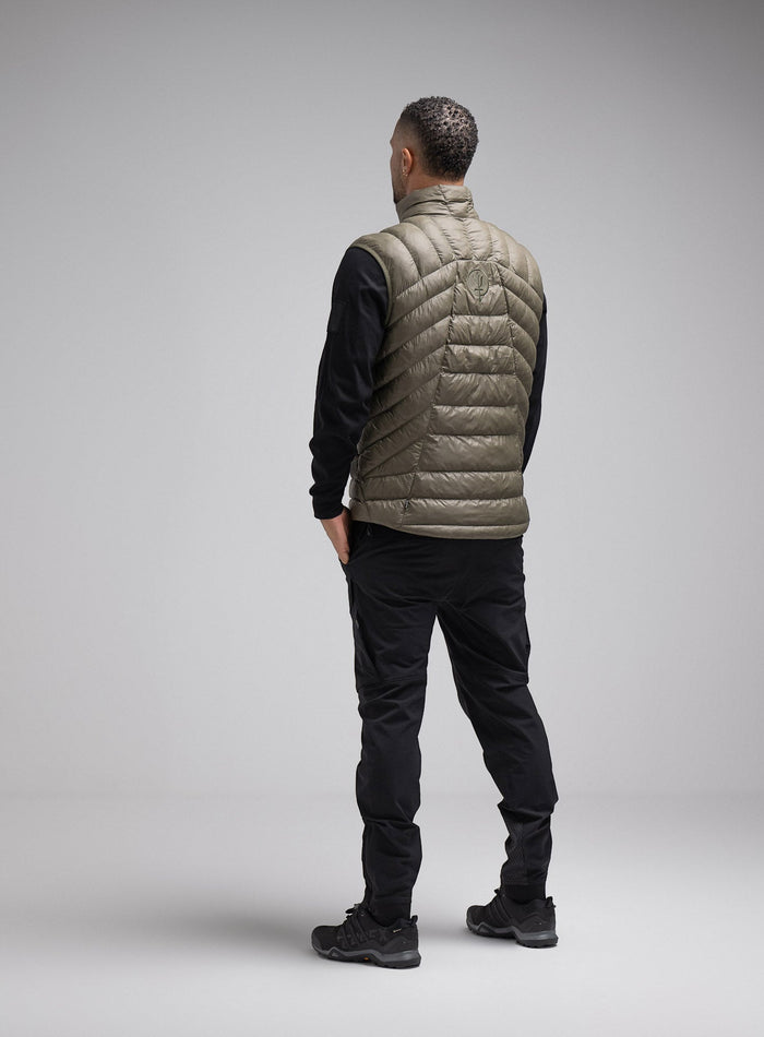 Dj Is 6ft 4" And Wears Size: Xl | Hem Studio Image Of Model Wearing Ithax Gilet In Olive Green (SS Model)