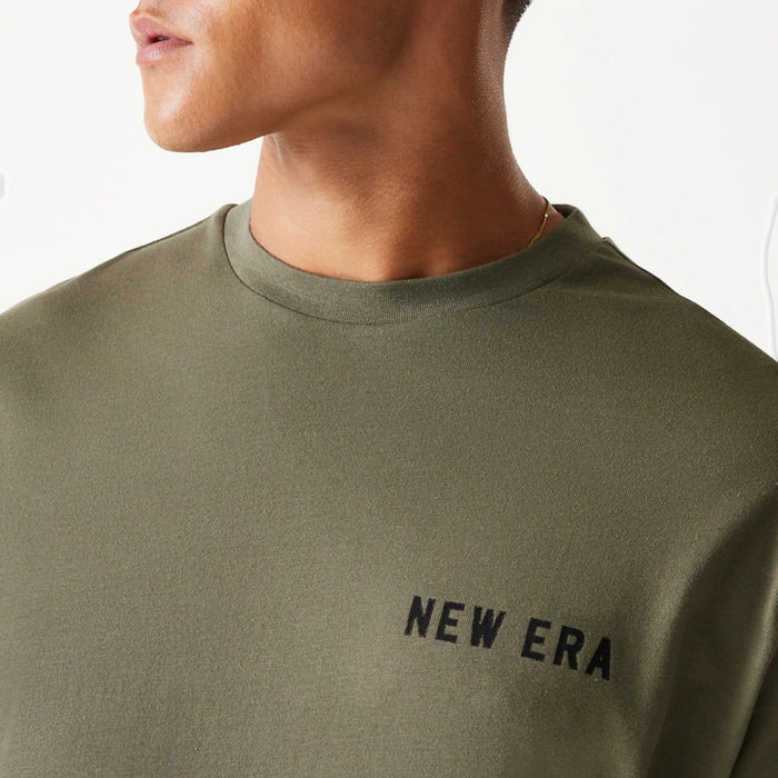 The Male model is wearing New Era Animal Graphic Green Oversized T-Shirt 7