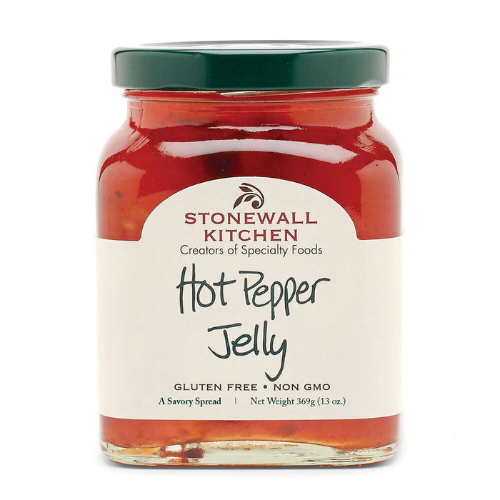 A jar of STONEWALL KITCHEN - HOT PEPPER JELLY is displayed with a red and green label. The label features the text "Stonewall Kitchen, Creators of Specialty Foods" and "Hot Pepper Jelly." This spicy pepper jam is gluten-free, non-GMO, and weighs 13 ounces (369 grams).