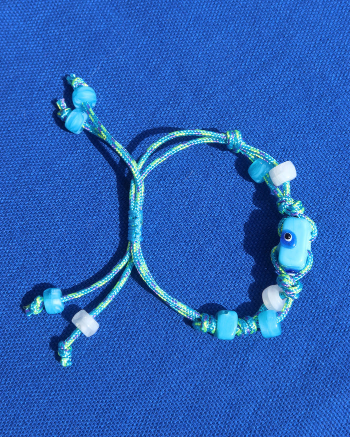 Turquoise blue adjustable woven rope bracelet with blue evil eye beads made in Greece