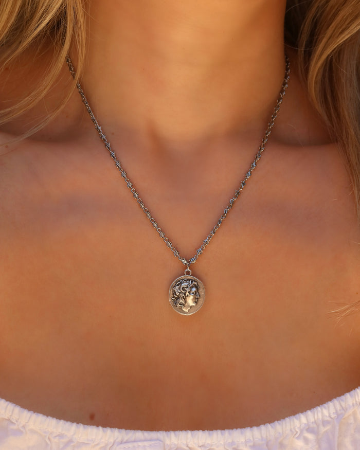 Woman wearing a silver Alexander the Great Greek coin necklace on an infinity chain, Greek coin jewelry