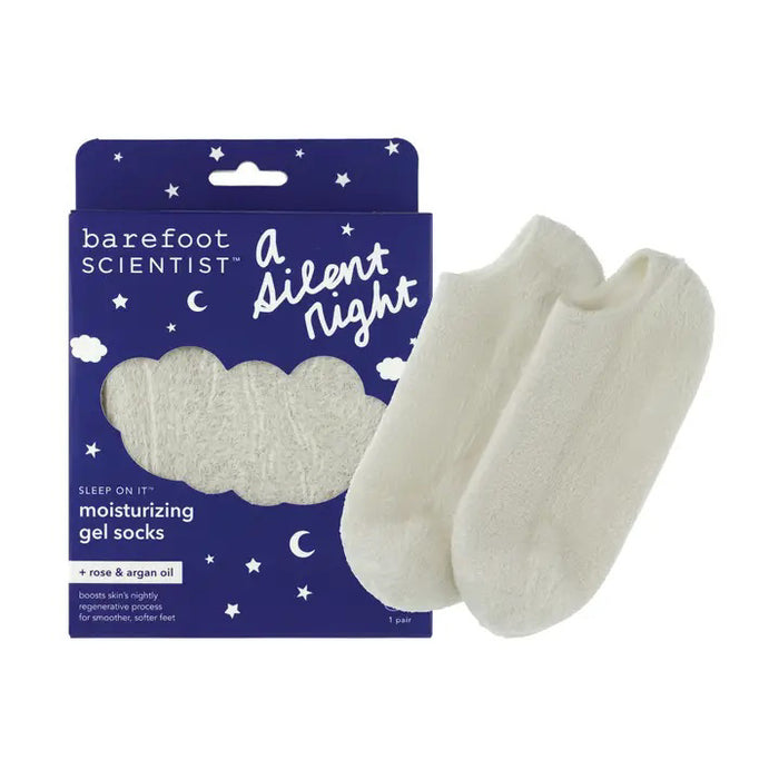 A box of BAREFOOT SCIENTIST SILENT NIGHT SLEEP ON IT SOCKS, with dark blue packaging decorated with white stars, moons, and clouds, is displayed next to a pair of soft white socks.