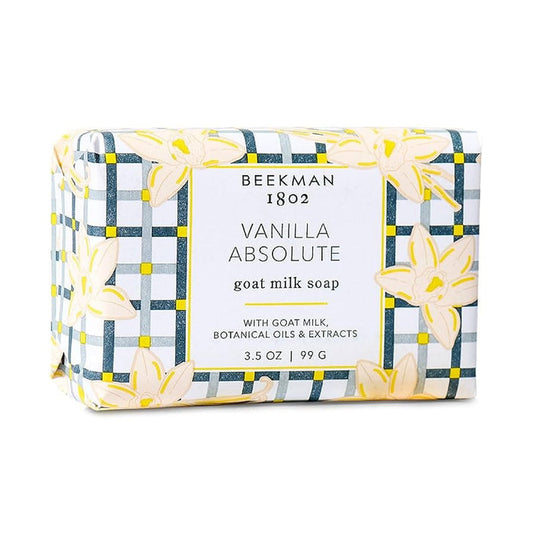 BEEKMAN - VANILLA ABSOLUTE BAR SOAP 3.5OZ by BEEKMAN - STA ELEMENTS is a moisturizing goat milk soap with botanical oils and extracts, wrapped in patterned paper with yellow flowers and blue checks.