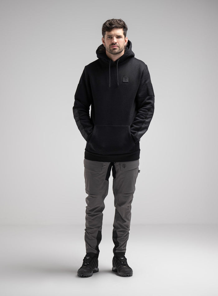 Bernie Is 6ft And Wears Size: M | Hem Studio Image Of Model Wearing Black Ops Dyneema®️ Hoody G2 In Hoody (SS Model)