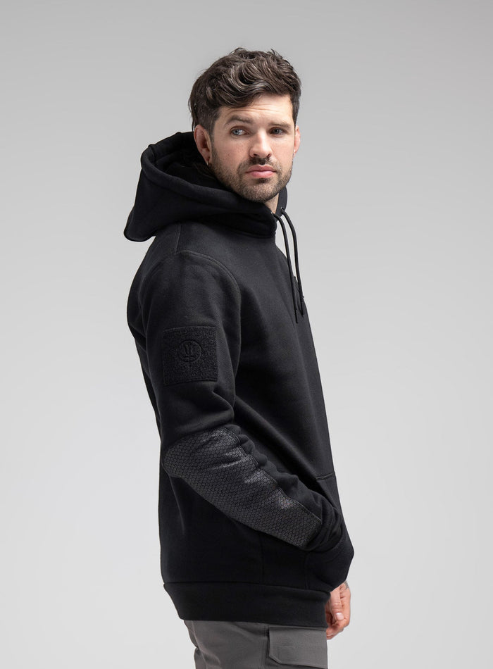 Bernie Is 6ft And Wears Size: M | Hem Studio Image Of Model Wearing Black Ops Dyneema®️ Hoody G2 In Hoody (SS Model)