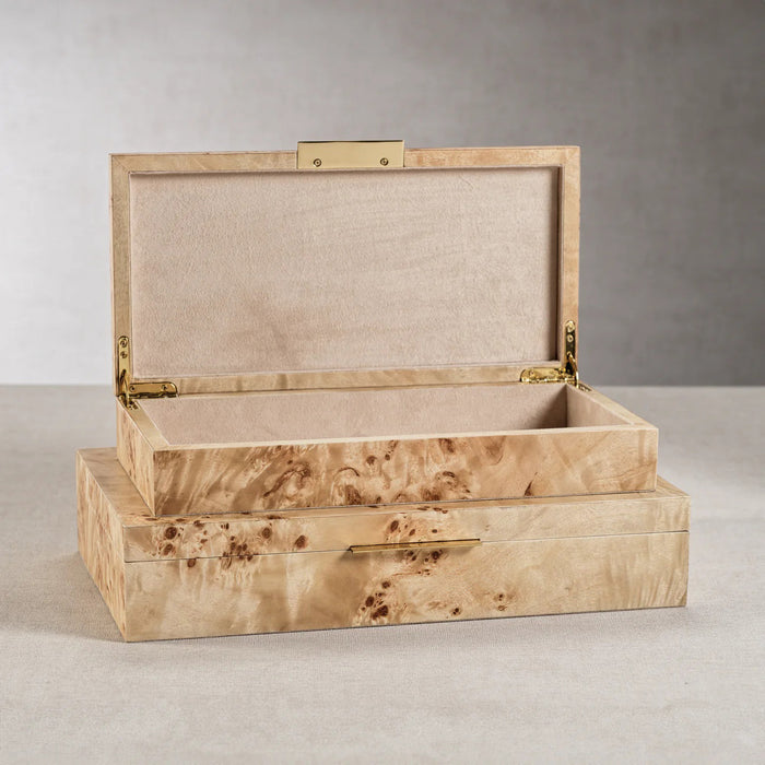 The ZODAX BURL WOOD VENEER BOX - LARGE is a rectangular, light brown box with a glossy marbled finish and a slim gold front handle, shown against a white background.