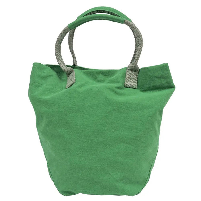 The TRAVAUX EN COURS CANVAS TOTE BAG is a versatile teal accessory with beige 100% cotton canvas handles. It features a spacious main compartment, with securely stitched handles ideal for carrying by hand or over the shoulder.