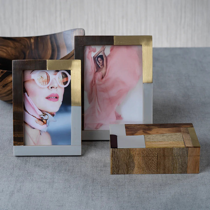 The ZODAX CAPE TOWN PHOTO FRAME 5X7 is a rectangular polyresin frame with gold, silver, and bronze metallic segments, featuring a photo placeholder on a white background.