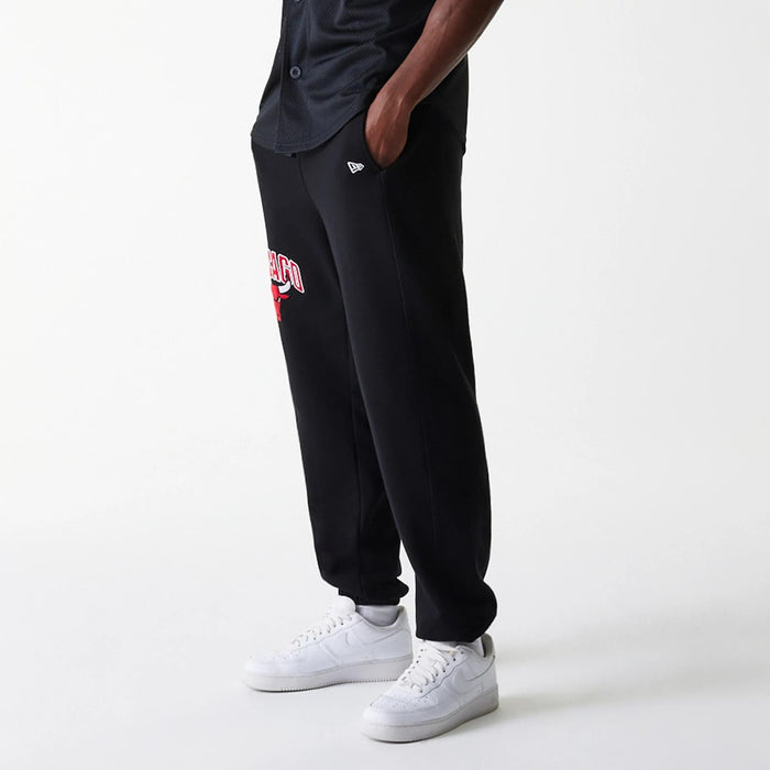The Male model is wearing Chicago Bulls NBA Arch Graphic Black Joggers 3