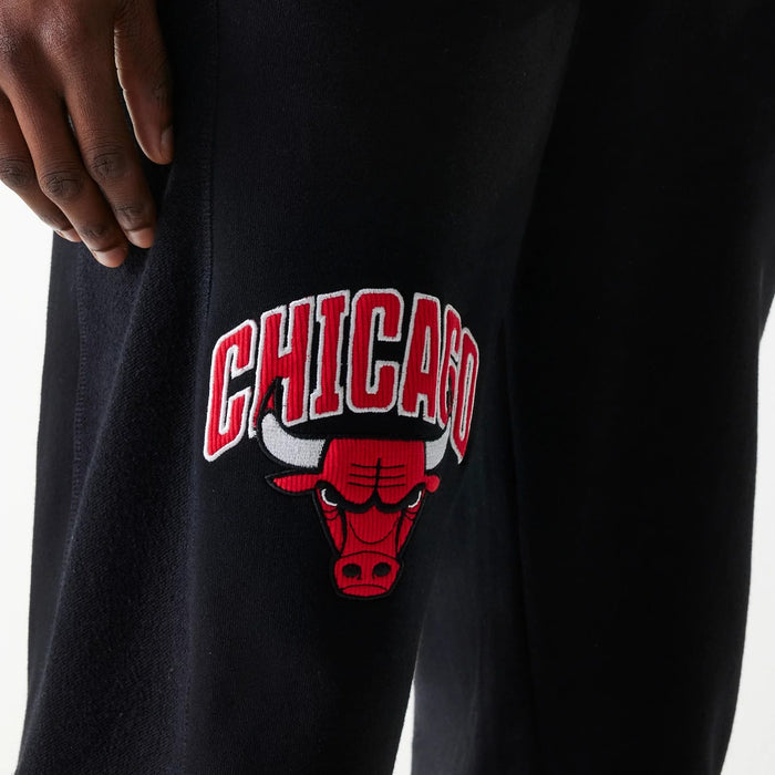The Male model is wearing Chicago Bulls NBA Arch Graphic Black Joggers 4