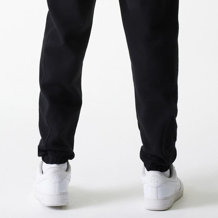 The Male model is wearing Chicago Bulls NBA Arch Graphic Black Joggers 7