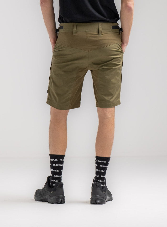 Rudie Is 6ft 2" And Wears Size: M | Hem Studio Image Of Model Wearing Command Shorts In Khaki (SS Model)