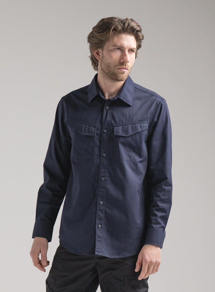 Rudie Is 6ft 2" And Wears Size: M | Hem Studio Image Of Model Wearing Covert Shirt In Dark Sapphire (SS Model)