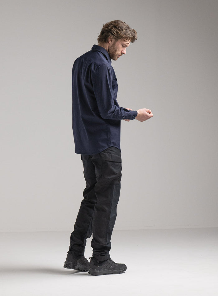 Rudie Is 6ft 2" And Wears Size: M | Hem Studio Image Of Model Wearing Covert Shirt In Dark Sapphire (SS Model)