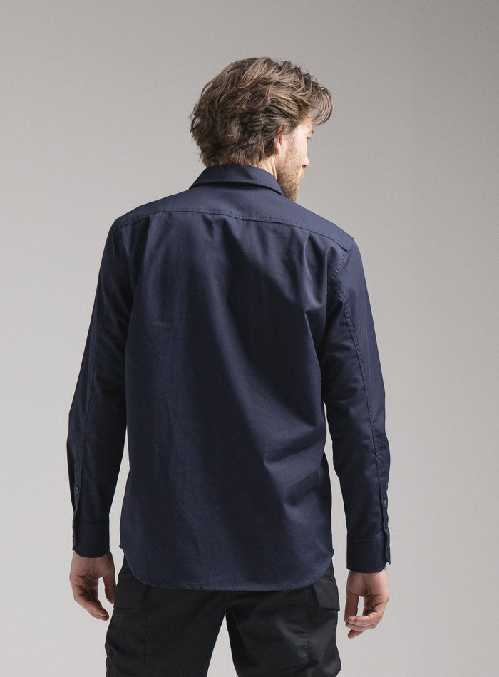 Rudie Is 6ft 2" And Wears Size: M | Hem Studio Image Of Model Wearing Covert Shirt In Dark Sapphire (SS Model)