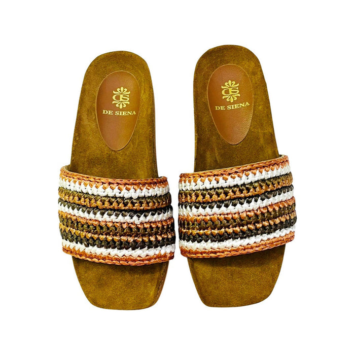 The DA SIENA - LUCILLA RAFIA SLIDE by DE SIENA features open-toe sandals with brown suede soles, a comfy eco footbed, wide multicolored woven straps in green, blue, yellow, and brown stripes, and a branded floral "DE SIENA" insole.