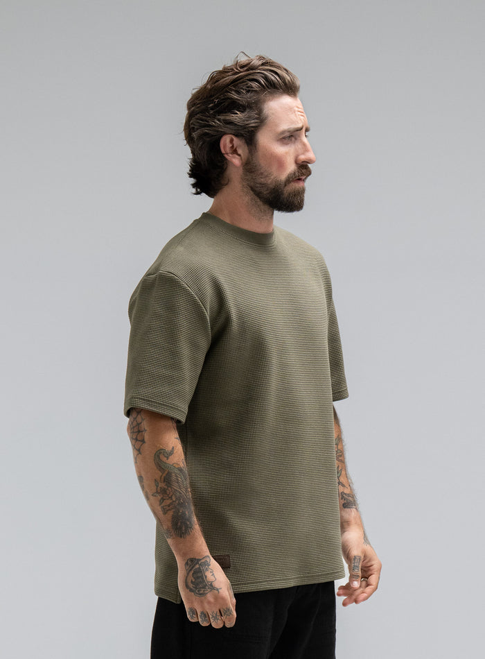 Max Is 5ft 8" And Wears Size: M | Hem Studio Image Of Model Wearing Dissident Waffle Short Sleeve T-Shirt In Khaki (SS Model)