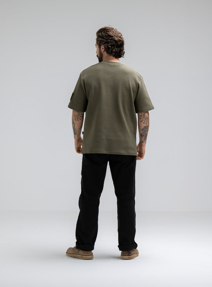 Max Is 5ft 8" And Wears Size: M | Hem Studio Image Of Model Wearing Dissident Waffle Short Sleeve T-Shirt In Khaki (SS Model)