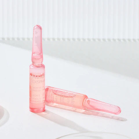 Two sleek, translucent DR MELAXIN - NECKSPHALT ECM NECK BARRIER AMPOULE bottles by KOSMIC KBEAUTY SKINCARE are displayed on a white surface with soft shadows—one upright, one lying down—in small pink packaging.