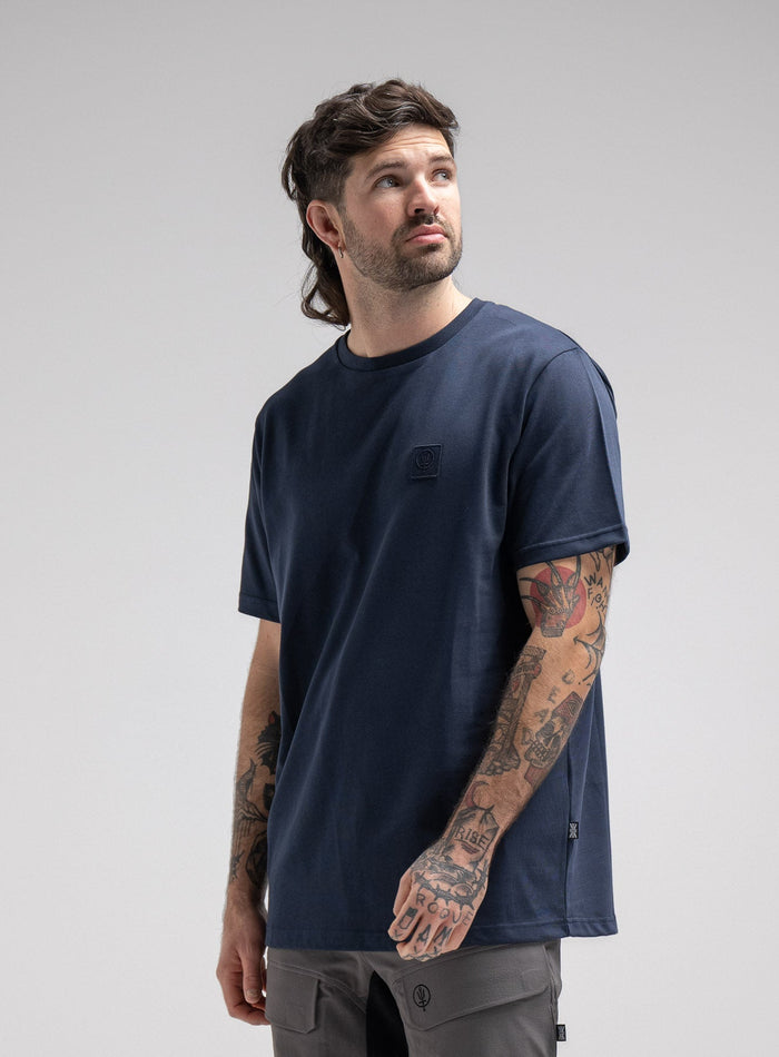 Bernie Is 6ft And Wears Size: M | Hem Studio Image Of Model Wearing Enigma Oversized Tee In Navy (SS Model)