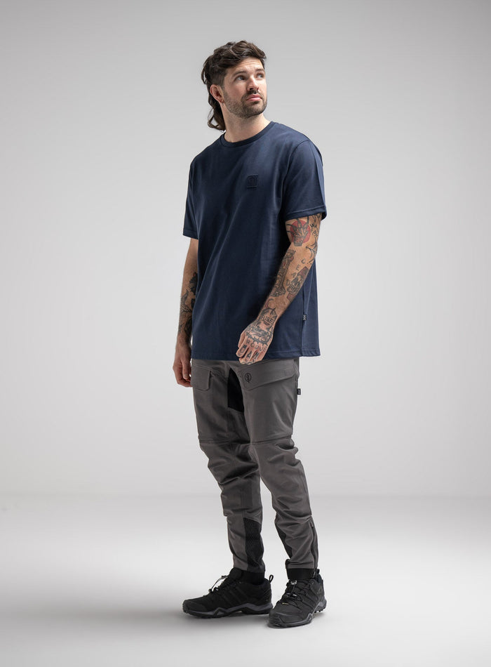 Bernie Is 6ft And Wears Size: M | Hem Studio Image Of Model Wearing Enigma Oversized Tee In Navy (SS Model)