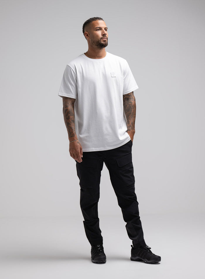 Dj Is 6ft 4" And Wears Size: Xl | Hem Studio Image Of Model Wearing Enigma Oversized Tee In White (SS Model)