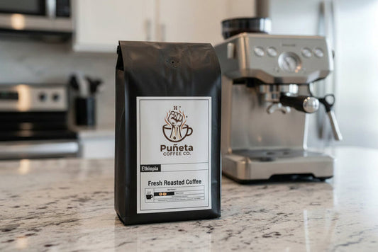 Black coffee bag with Puñeta Coffee Co. label