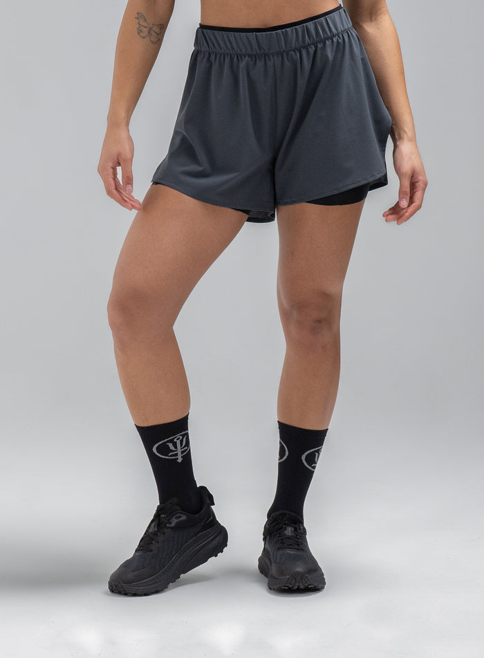Jade Is 5ft 8" And Wears Size: S | Hem Studio Image Of Model Wearing Force 2-In-1 Shorts Womens In Storm Blue (SS Model)