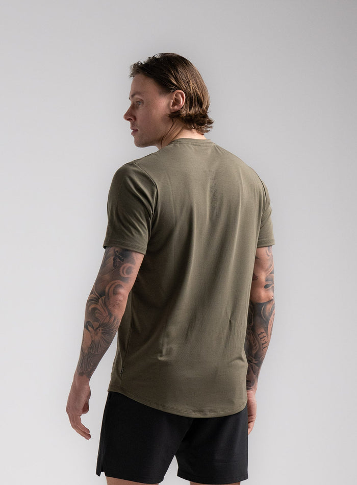 Angus Is 6ft 4" And Wears Size: L | Hem Studio Image Of Model Wearing Force Active Drirelease® Tshirt In Khaki (SS Model)