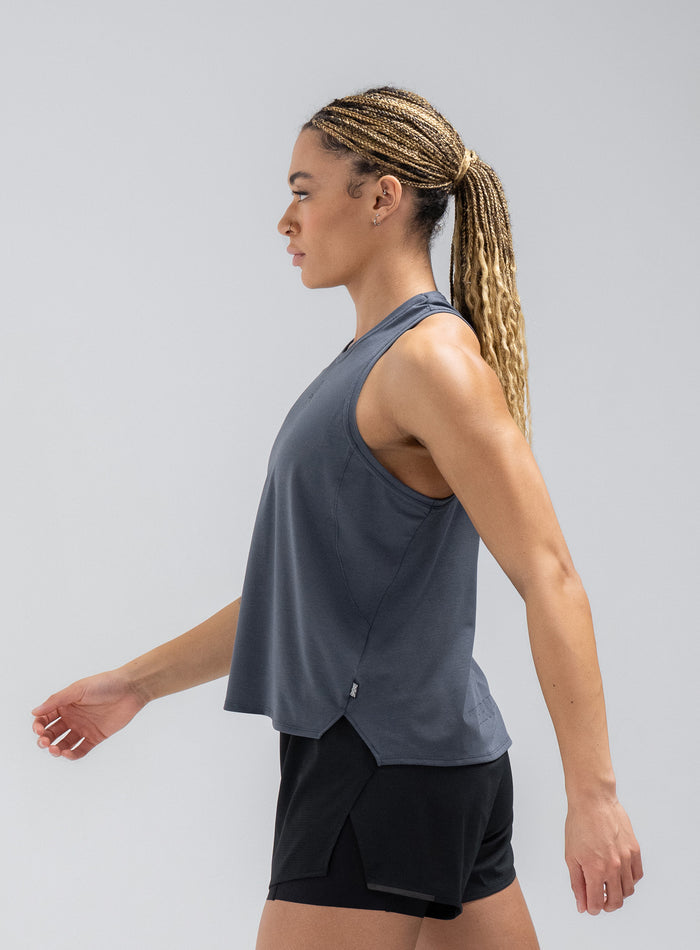 Jade Is 5ft 8" And Wears Size: S | Hem Studio Image Of Model Wearing Force Drirelease® Tank Vest In Storm Blue (SS Model)