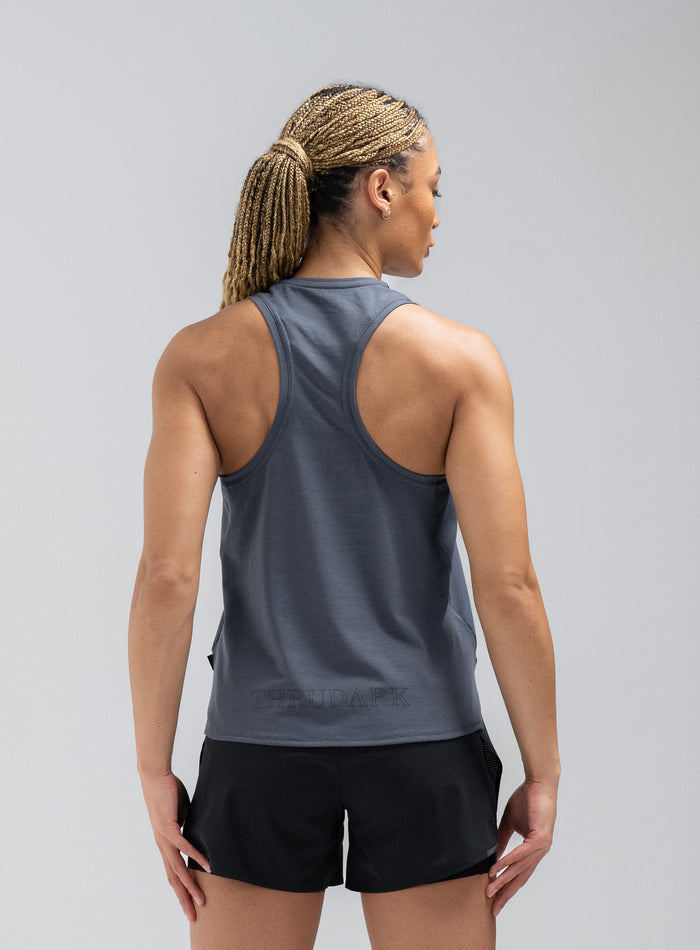 Jade Is 5ft 8" And Wears Size: S | Hem Studio Image Of Model Wearing Force Drirelease® Tank Vest In Storm Blue (SS Model)