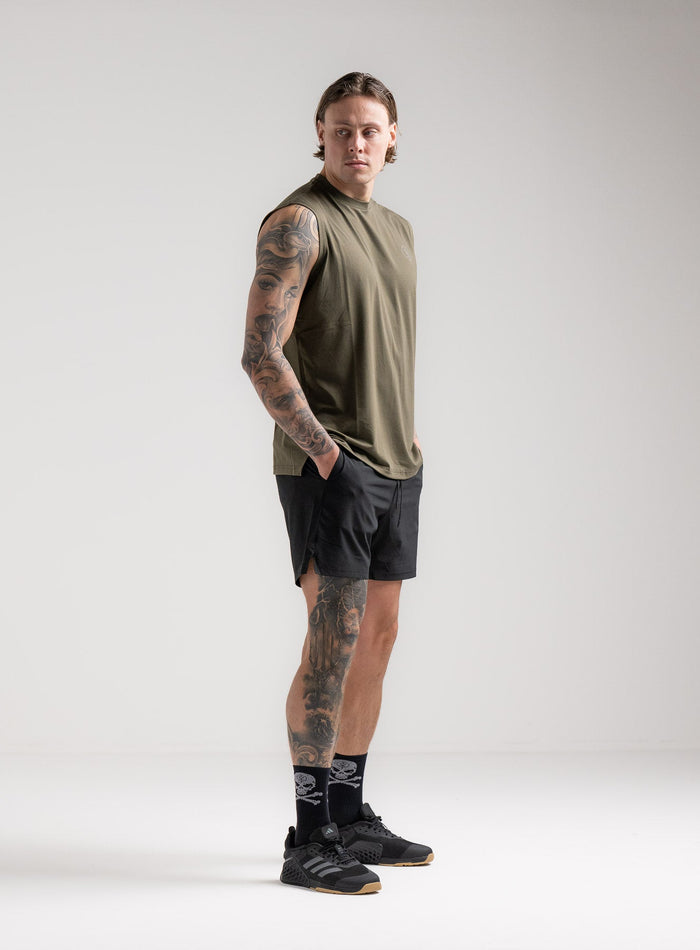 Angus Is 6ft 4" And Wears Size: L | Hem Studio Image Of Model Wearing Force Drirelease® Tank In Khaki (SS Model)