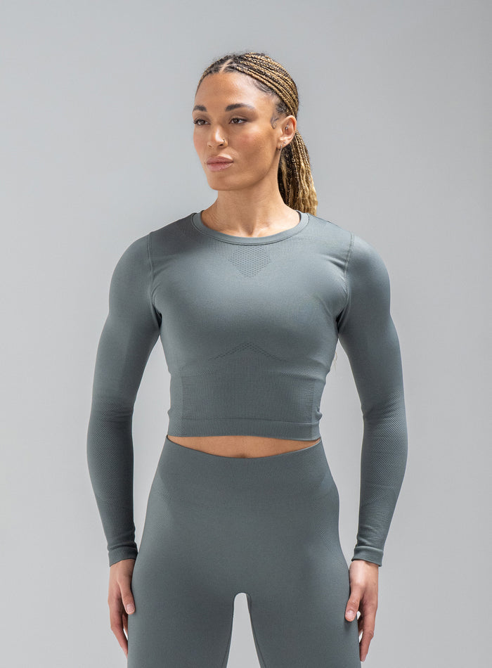 Jade Is Wearing Seamless And Is 5ft 8" And Wears Size: S/M | Hem Studio Image Of Model Wearing Force Seamless Long Sleeve Top In Urban Green (SS Model)
