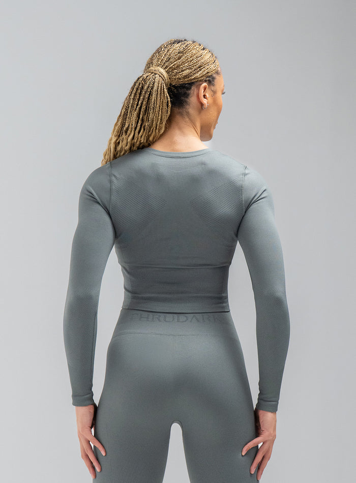 Jade Is Wearing Seamless And Is 5ft 8" And Wears Size: S/M | Hem Studio Image Of Model Wearing Force Seamless Long Sleeve Top In Urban Green (SS Model)