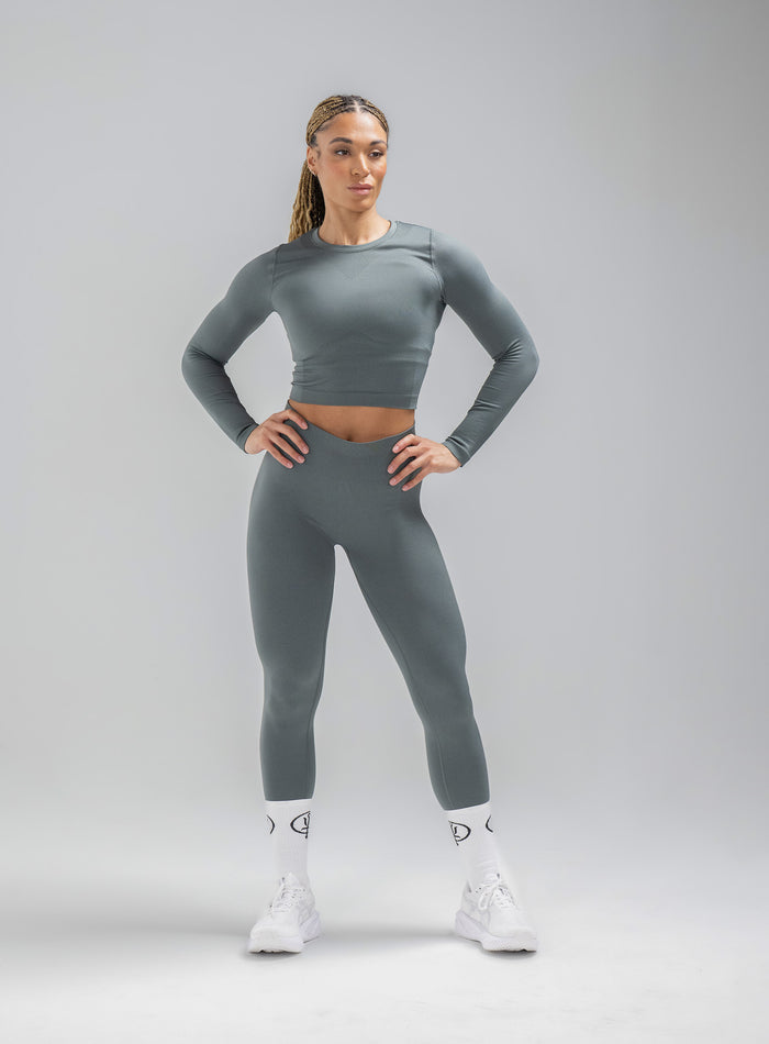 Jade Is Wearing Seamless And Is 5ft 8" And Wears Size: S/M | Hem Studio Image Of Model Wearing Force Seamless Long Sleeve Top In Urban Green (SS Model)