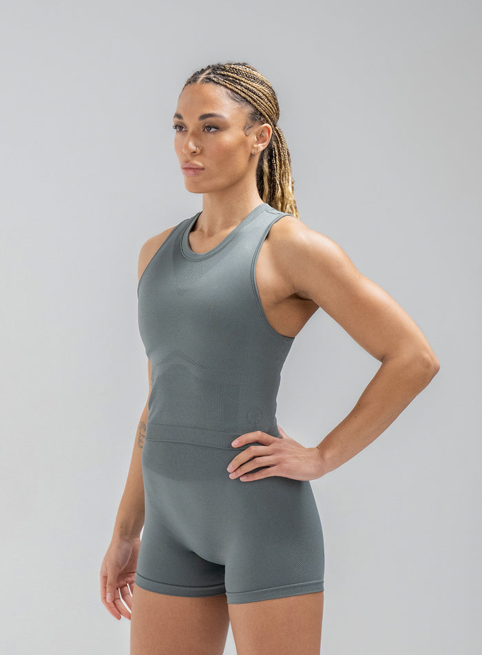 Jade Is Wearing Seamless And Is 5ft 8" And Wears Size: S/M | Hem Studio Image Of Model Wearing Force Seamless Tank Top In Urban Green (SS Model)