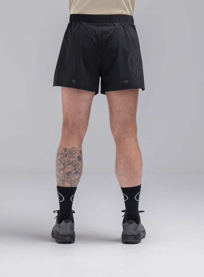 Chez Is 6ft And Wears Size: M | Hem Studio Image Of Model Wearing Force Trail Running 4” Shorts In Obsidian Black (SS Model)