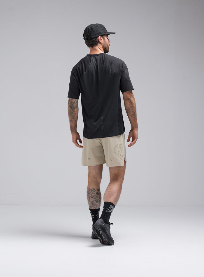 Chez Is 6ft And Wears Size: M | Hem Studio Image Of Model Wearing Force Trail Running 7" Shorts In Stone (SS Model)