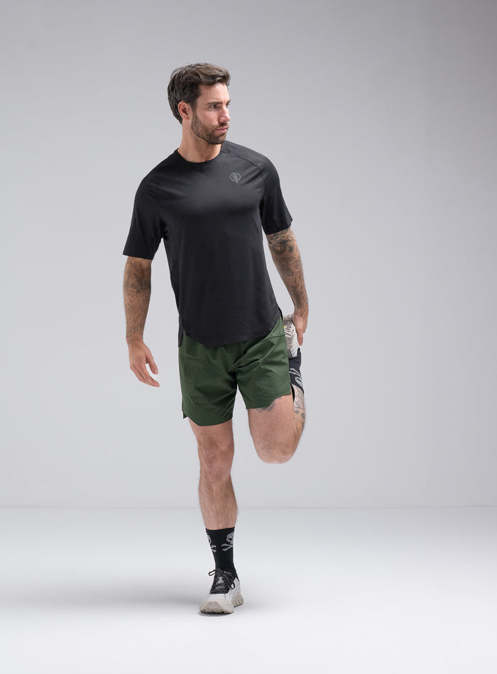 Chez Is 6ft And Wears Size: M | Hem Studio Image Of Model Wearing Force Trail Running 7" Shorts In Forest Green (SS Model)