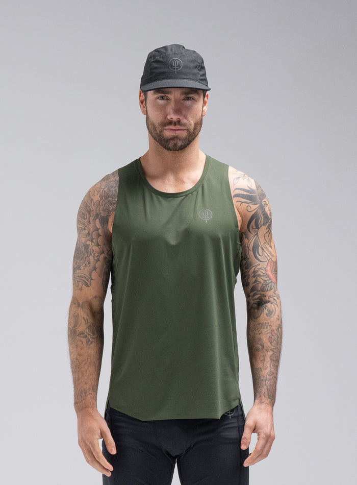 Chez Is 6ft And Wears Size: M | Hem Studio Image Of Model Wearing Force Trail Running Singlet In Forest Green (SS Model)