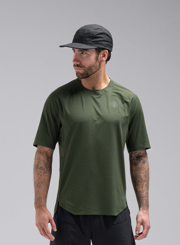 Chez Is 6ft And Wears Size: M | Hem Studio Image Of Model Wearing Force Trail Running T-Shirt In Forest Green (SS Model)