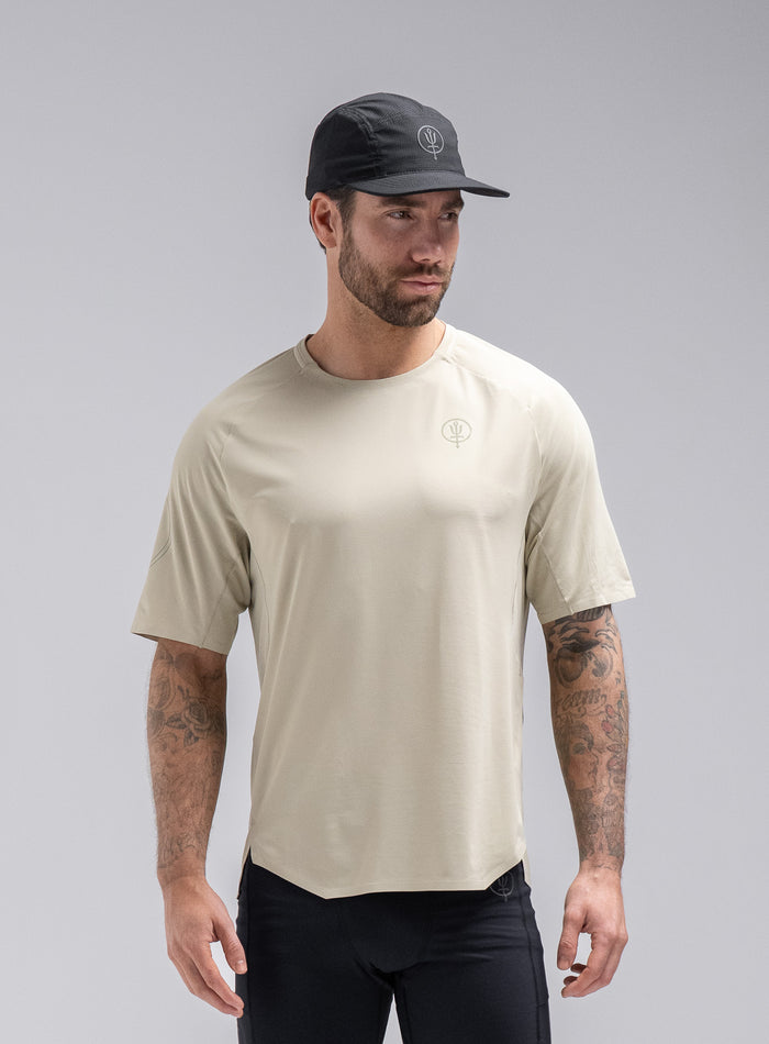 Chez Is 6ft And Wears Size: M | Hem Studio Image Of Model Wearing Force Trail Running T-Shirt In Stone (SS Model)