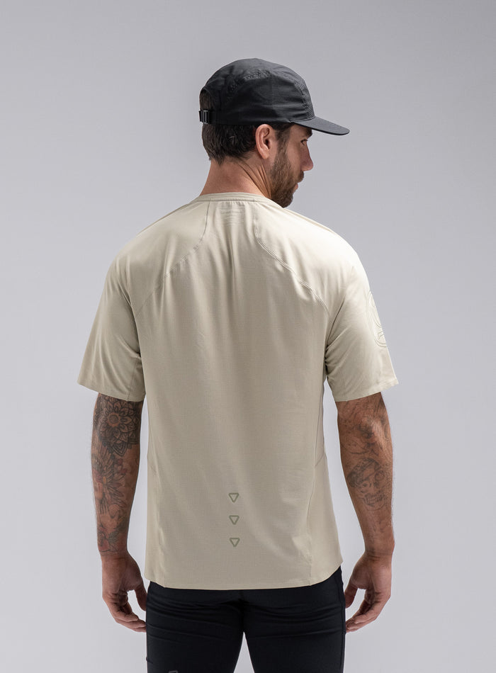 Chez Is 6ft And Wears Size: M | Hem Studio Image Of Model Wearing Force Trail Running T-Shirt In Stone (SS Model)