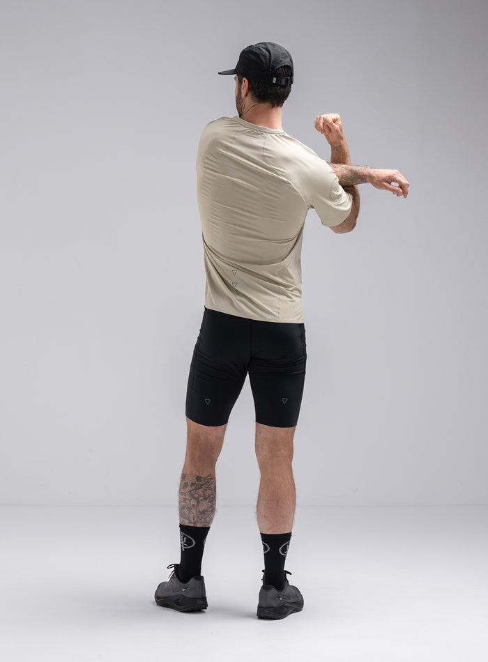 Chez Is 6ft And Wears Size: M | Hem Studio Image Of Model Wearing Force Trail Running T-Shirt In Stone (SS Model)
