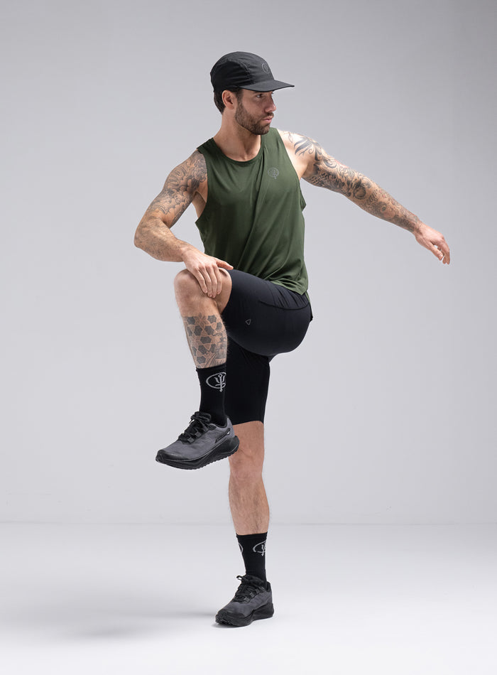 Chez Is 6ft And Wears Size: M | Hem Studio Image Of Model Wearing Force Trail Running Tight Shorts In Obsidian Black (SS Model)