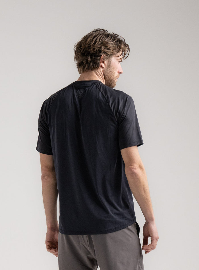 Rudie Is 6ft 2" And Wears Size: M | Hem Studio Image Of Model Wearing Force Velocity Motion T-Shirt In Obsidian Black (SS Model)